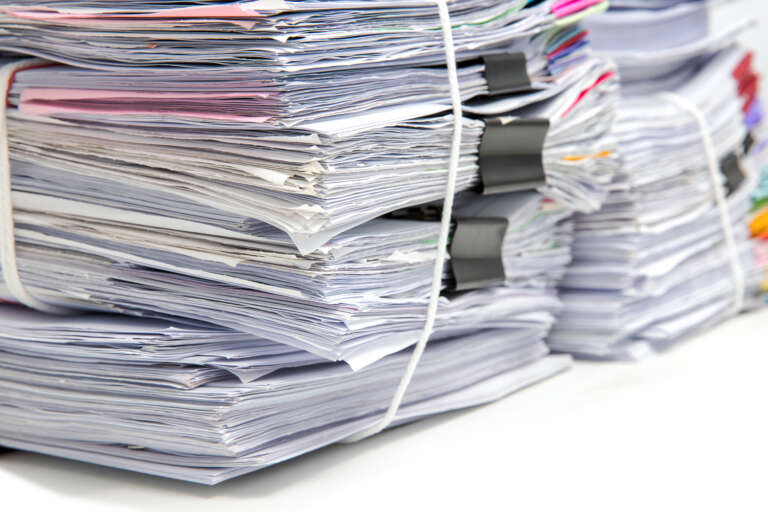 Desk full of training data papers